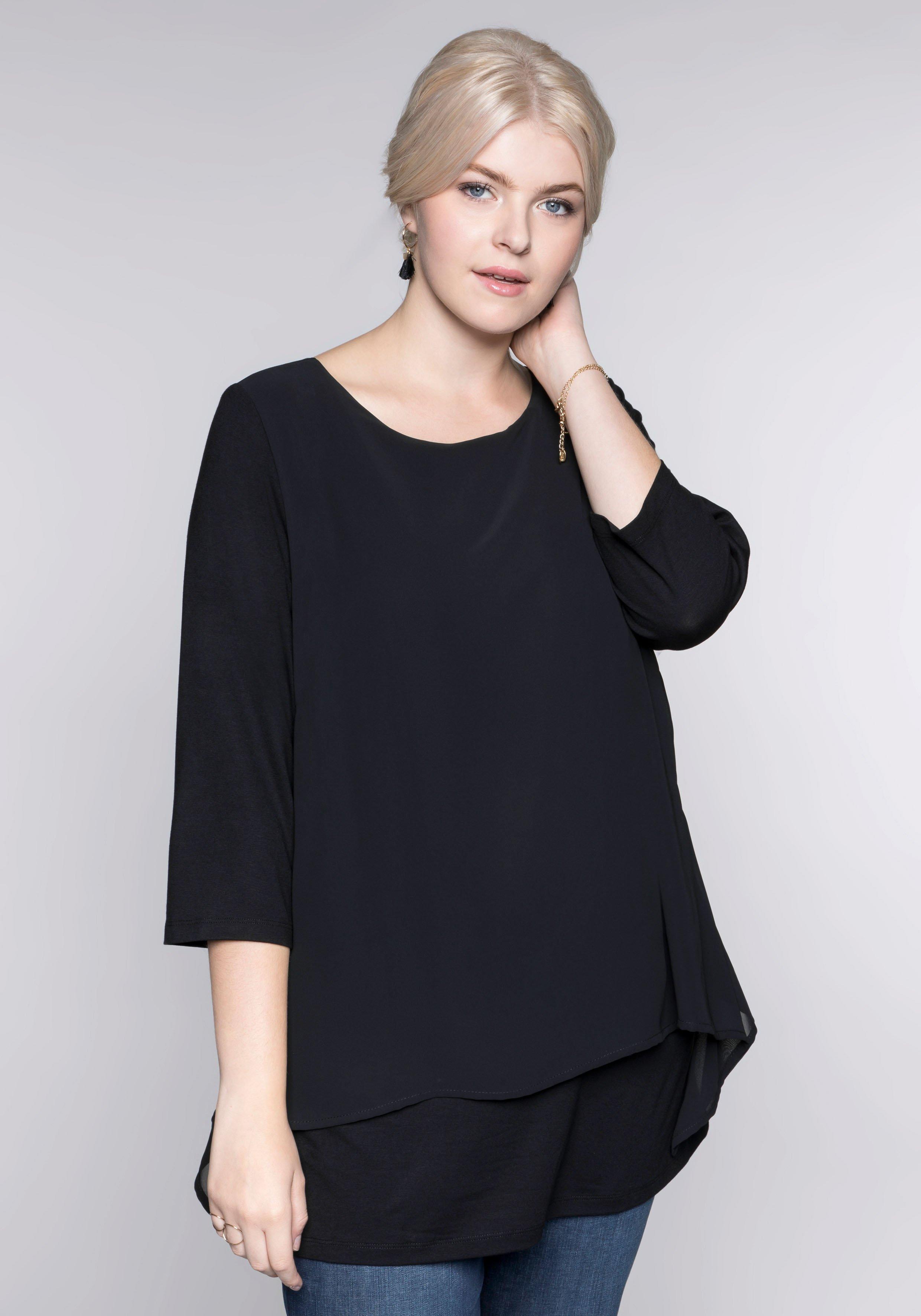 sheego Blusenshirt in leichter A-Linie mit Zipfelsaum - schwarz sheego