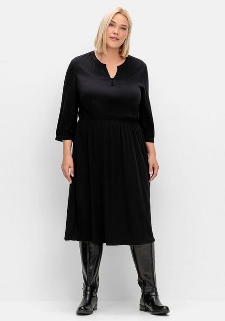 Tailliertes Kleid mit Taschen, in Strukturqualität - schwarz | sheego