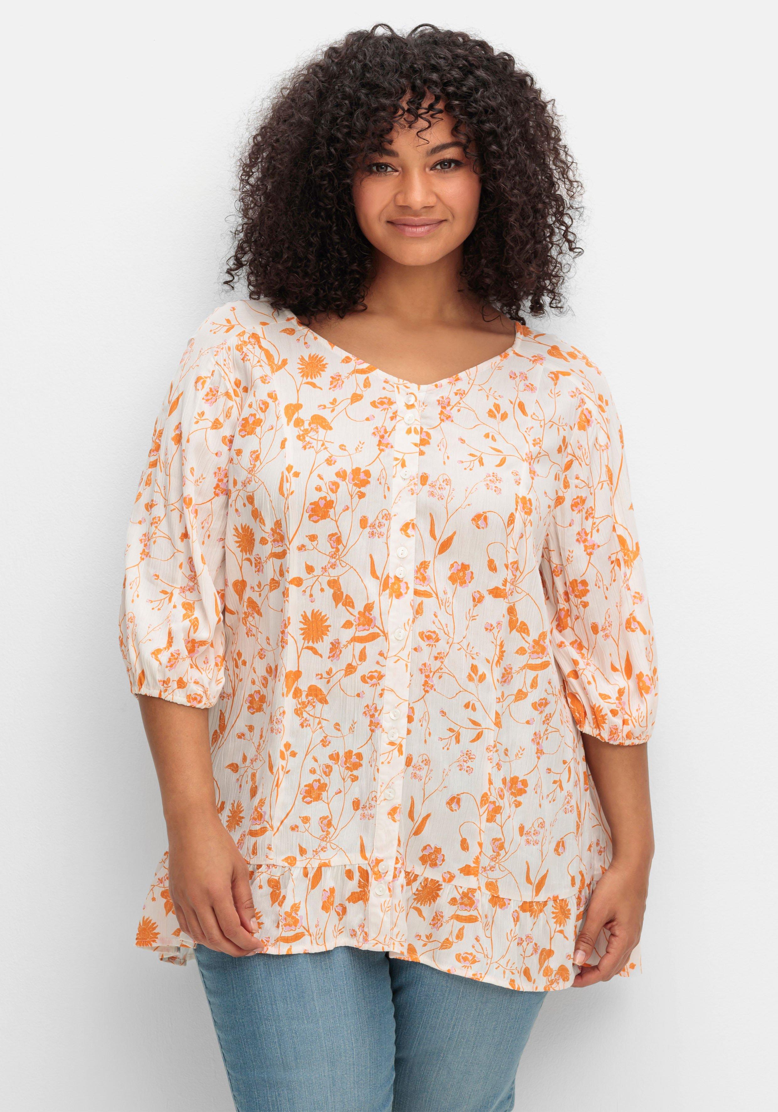 sheego Crêpe-Bluse mit Blumendruck und Volant am Saum - weiß gemustert sheego